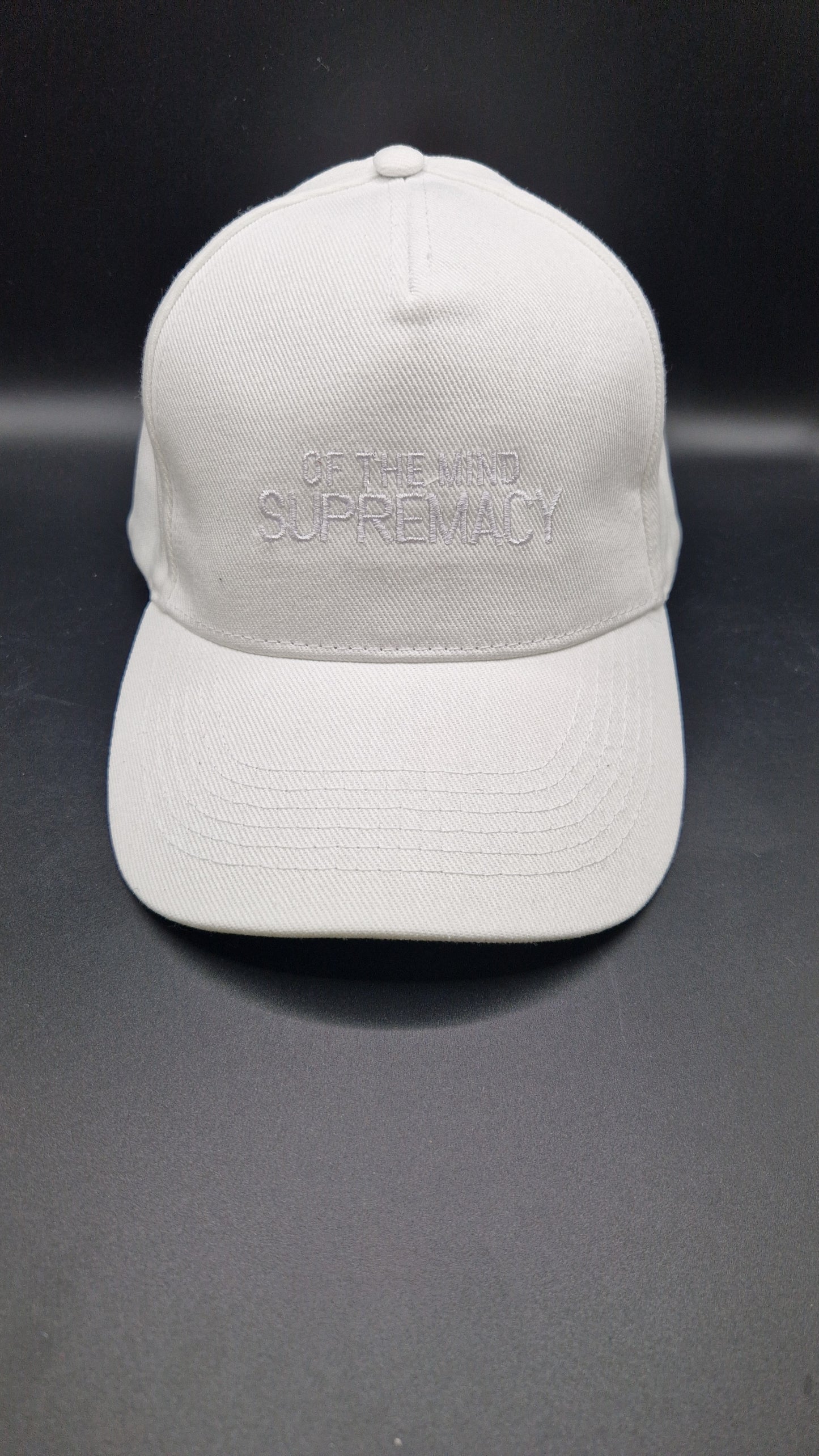 White thread on a white baseball cap