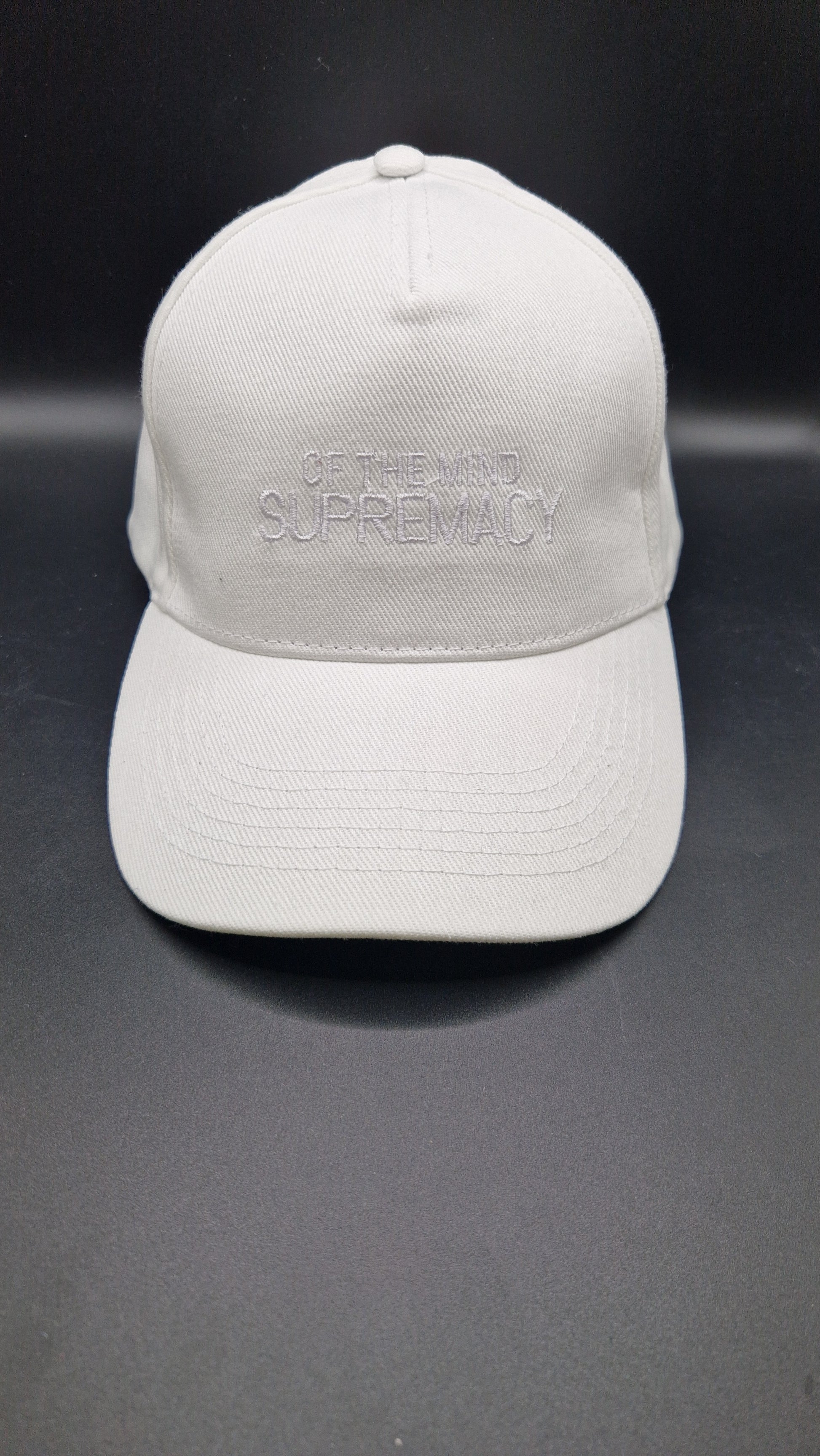 White thread on a white baseball cap