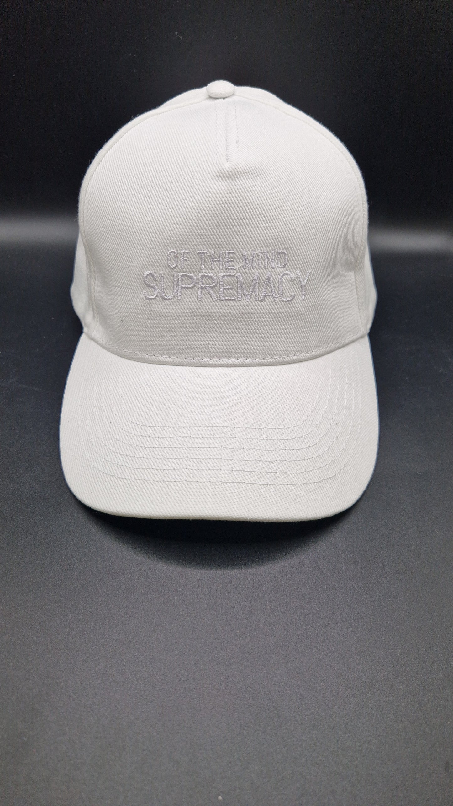 White thread on a white baseball cap
